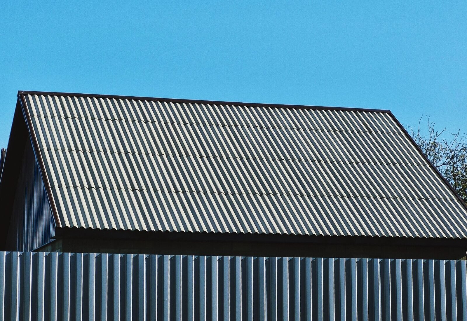 Corrugated metal roofing panels, a durable ice-dam-resistant alternative to asphalt shingles on Grand&nbsp;Rapids homes