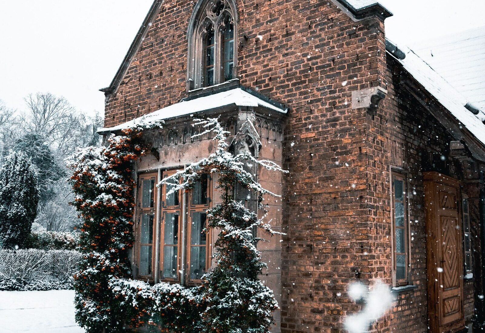 Brick craftsman-style Lowell, MI home with a snow-covered roof, representative of the city&rsquo;s historic river-town core near the Flat River